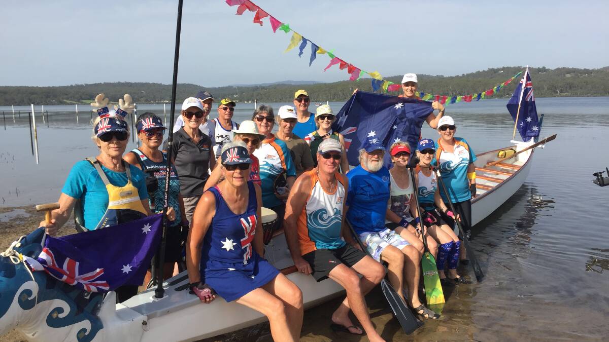 Flying the flag: Merimbula Water Dragons took to the water on Australia Day for a paddle to Spencer Park for morning tea before returning to Top Lake.