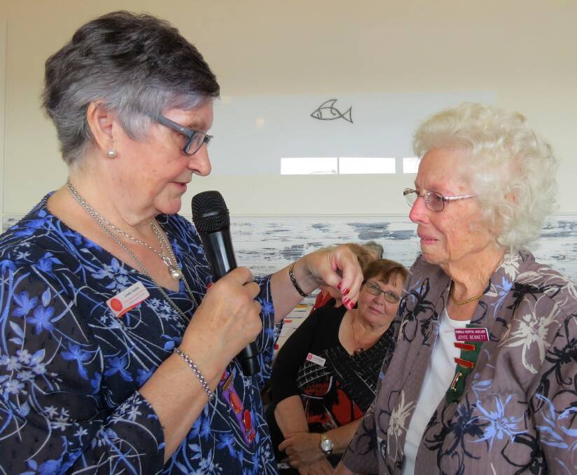 Joyce Bennett (PDHA) is presented with her 20 year volunteer badge by Linda Swales UHA of NSW president.
