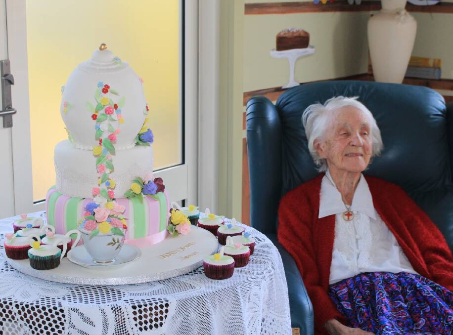 Janet Gill celebrating her 100th birthday at Imlay House Nursing Home on Wednesday. The elaborate teapot cake was made locally.