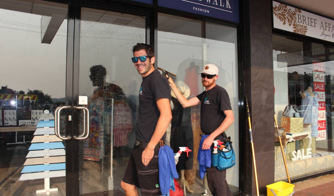 Tom and Nathan from Pure Window Cleaning Services were busy on Monday morning getting the town looking spick and span.