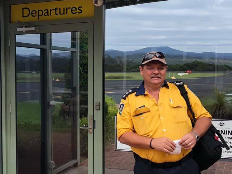 Fire fighter Peter Reynolds at Merimbula Airport before flying to Tasmania to assist with remote area fire fighting.