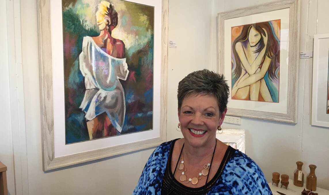 Pauline Cantwell with two of her pastel drawings.