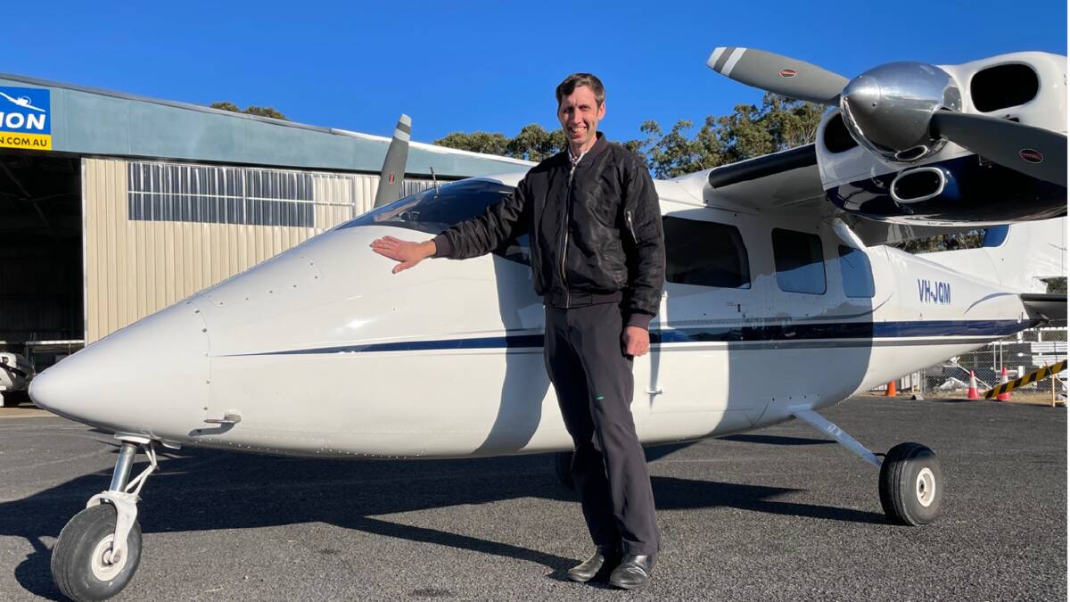Merimbula Air Services pilot Matthew Allen with the Partenavia which is being used in the search. Picture supplied