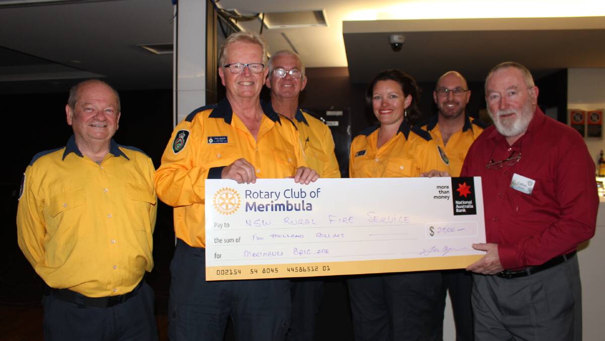 RFS members with Neville Dalton of Merimbula Rotary with a cheque for $2000.