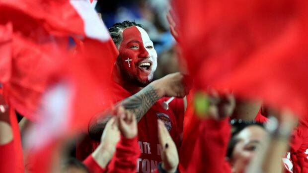 Shocking the world: Tongan fans celebrate in Hamilton. Photo: AAP