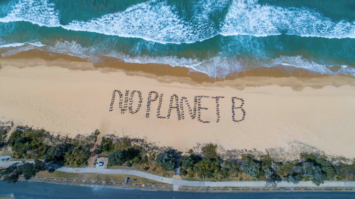 Collective action: No Planet B created by the student strikers and community on Aslings Beach. Photo: Brent Occleshaw