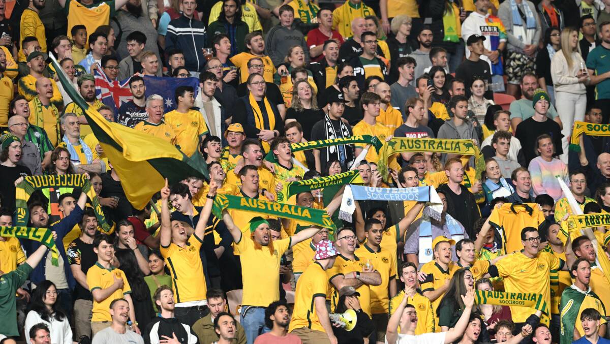 Fans cheering on the Socceroos. Picture by AAP Image/Darren England