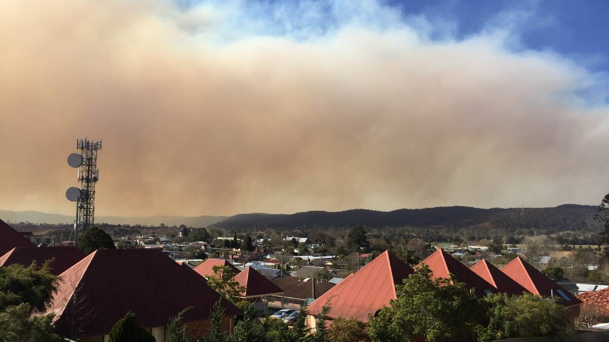 The smoke from the bushfire near Bemboka drifts east past Bega around midday on Wednesday. 