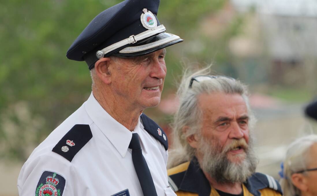 Superintendent John Cullen (left) visits Quaama in January after the bushfire hit the town. Picture: Albert McKnight 