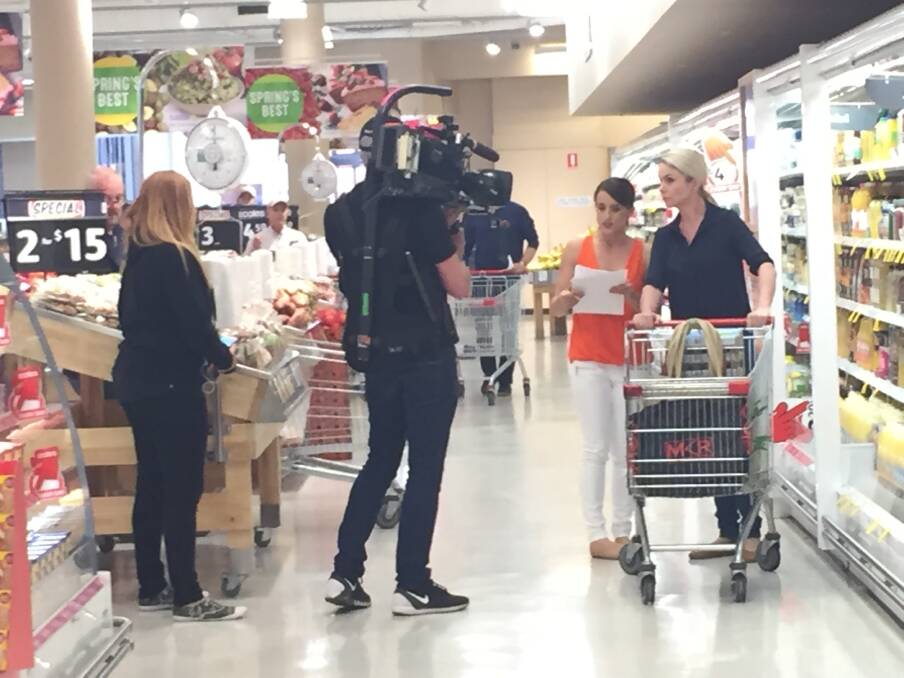 SPOTTED: Two My Kitchen Rules contestants shopping in Fairy Meadow on Thursday morning. The women grabbed eggs, sugar, sour cream and other items while a cameraman, sound man and two producers followed.