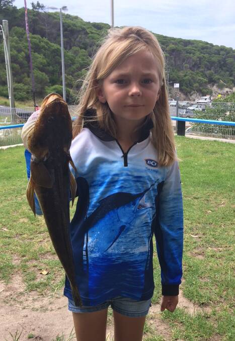 Great catch!: Eight-year-old Silvia Williams of Canberra shows her ocean flathead taken near Kianinny. Off the Tura Golf Course, Tura Headland, Bournda Island and north of Kianinny appear to be the best spots for these fish. 