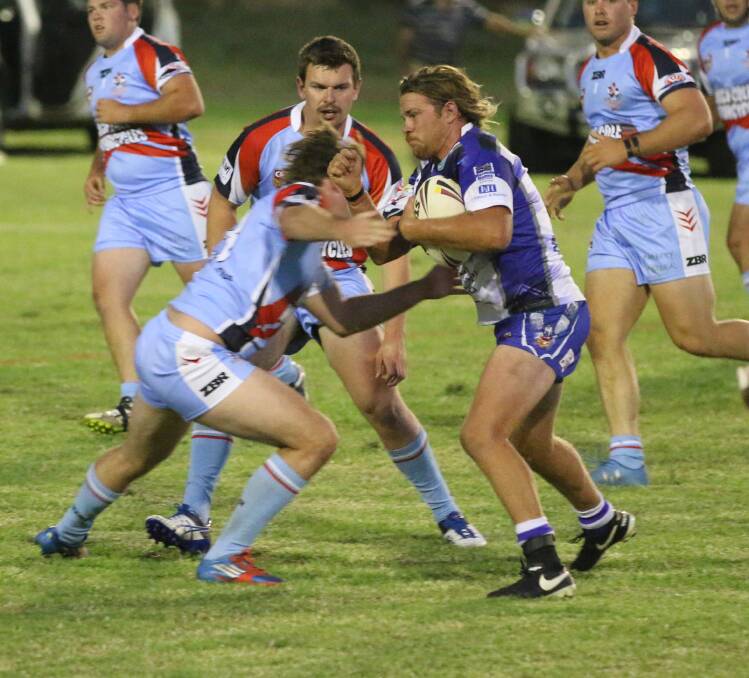 Hard man: Daniel Cronk hits up against the Bega Roosters for the Merimbula-Pambula Bulldogs during their round one encounter. 