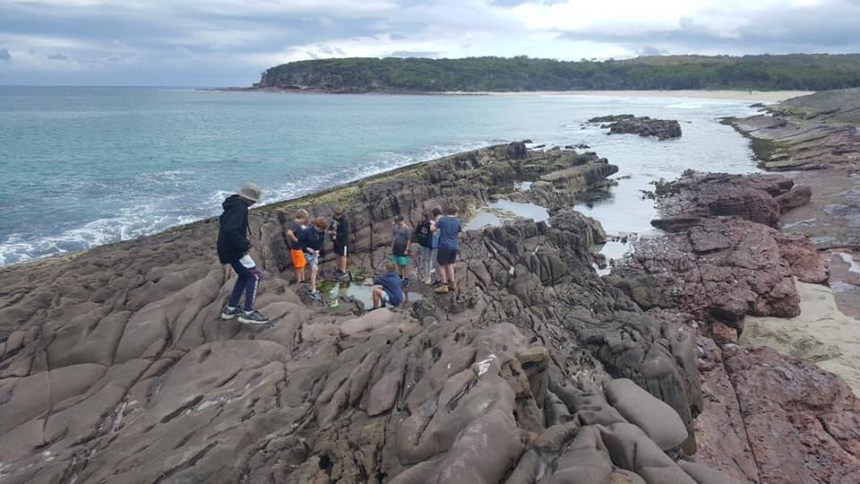 Merimbula Scouts check out some rock pools during one of their hikes. A new survey shows Scouts are more self-confident and mentally resilient than peers the same age.