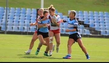 Narooma's Lilly Bennett in action during a recent match with the 16-year-old named in Australia's Youth Rugby side for the Commonwealth Games. 