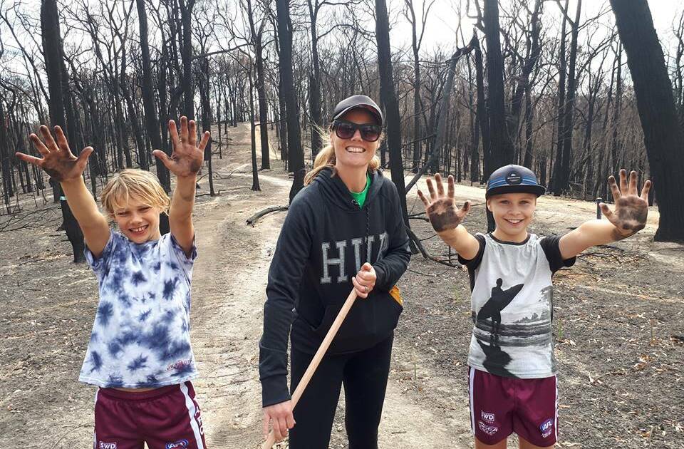 Trails cleaned: Some of the volunteers during the 'Rake and Ride' clean-up quite literally get their hands dirty at the weekend. 