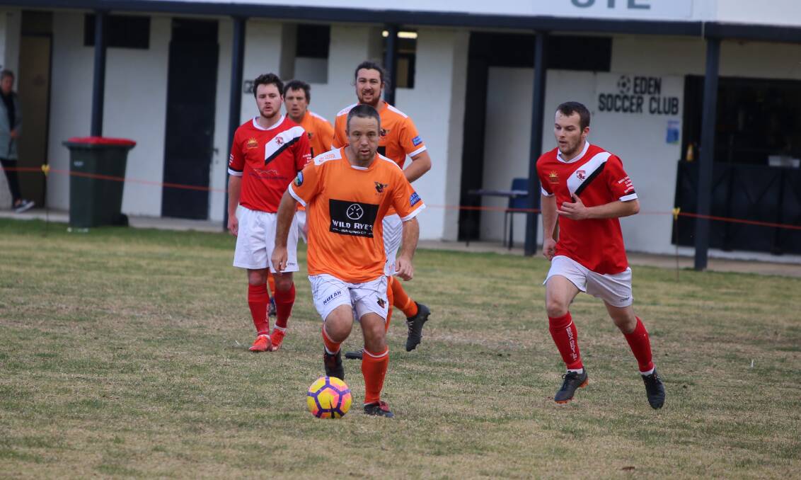 Stoic defender: Pambula defender Tim Wilson works the ball out of the backlines against the Bega Devils on Sunday. 