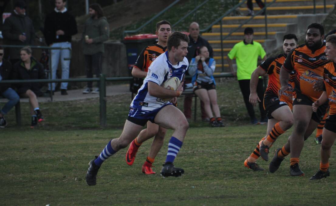 Magnus Gillberg makes an impactful run through the ruck for the Merimbula-Pambula Bulldogs who scored a win over the Bay Tigers to finish third. 