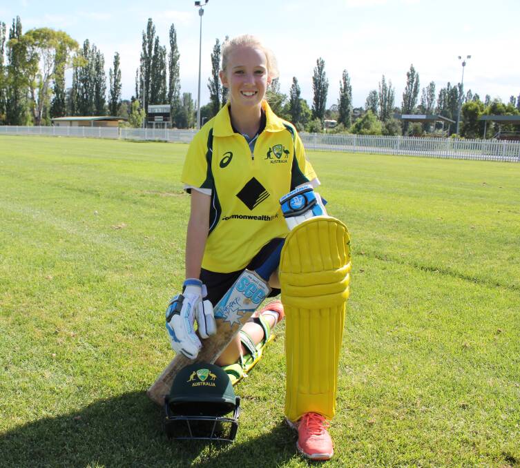 National contender: Cobargo's Jade Allen in the gold Australian playing strip she will wear as part of the Cricket Australia XI under 15s next week. 
