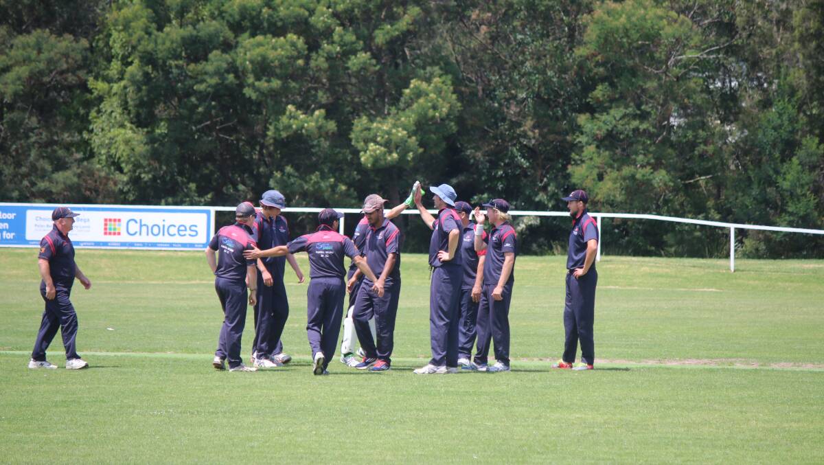 Knights players celebrate a wicket with the club comfortably in second ahead of finals play. 
