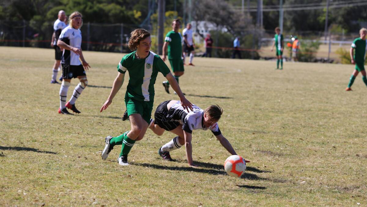 The Merimbula Grasshoppers, pictured in a grand final against Eden, will host juniors and women's fixtures starting Sunday. 