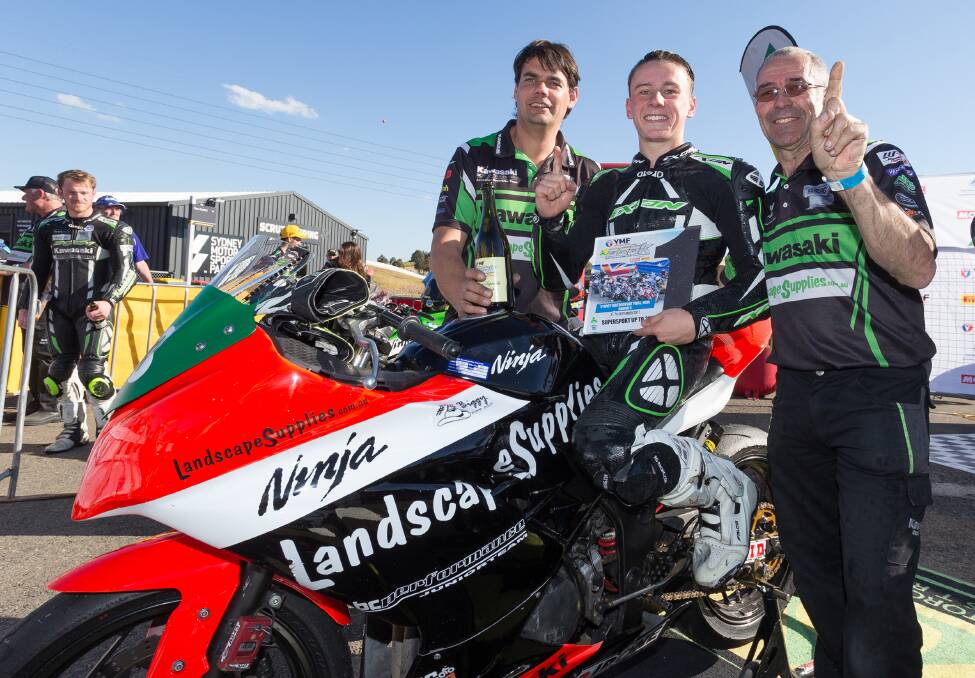 Australian super bike champ: BC Performance team manager Kelvin Reilly and crew chief Ronnie Granger congratulate Reid Battye on his win. Picture: Keith Muir.