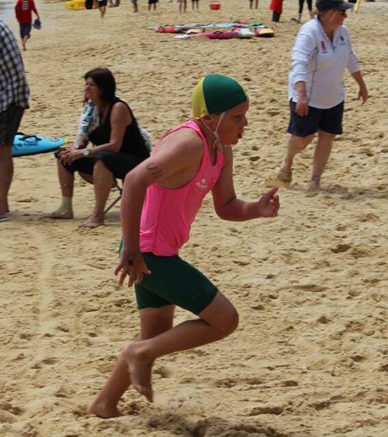 Pambula ironman: Lachie Harvey races up the beach at Bermagui during the first nippers beach carnival in the under 11s age bracket. 