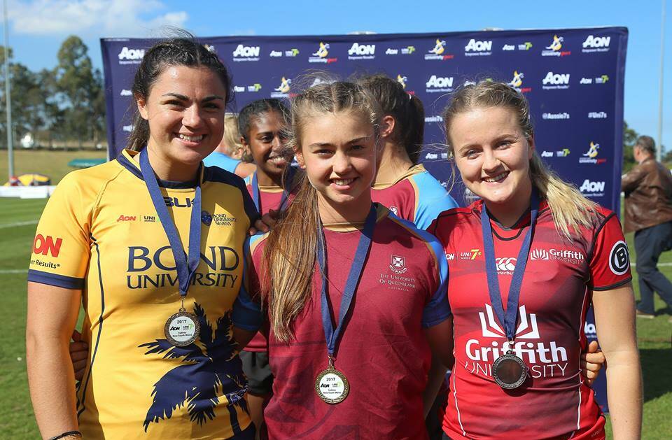 Millie Boyle, in her Bond University gear with fellow Uni 7s players Lily Dick and Katie Curtis, has signed with the Queensland Reds XV for the 2019 Super W season. 
