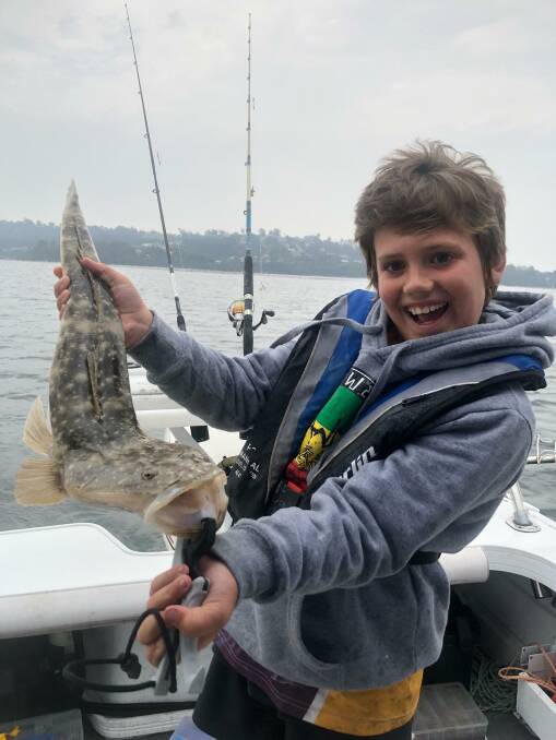 Look what I caught!: Junior Kade Thornhill of Victoria shows his lovely catch and release dusky flathead from the Merimbula Top Lake.