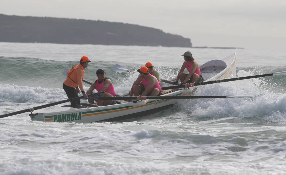 The Pambula junior men's surf team - known as The Ladz - launches off Pambula Beach for last year's Club to Pub. 