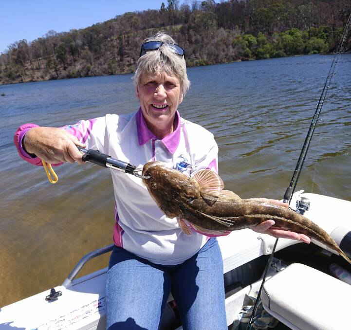 Back you go: MBGLAC member Merrily Bell of Tura Beach shows her lovely catch and release dusky flathead at Mogareeka in the Bega River.