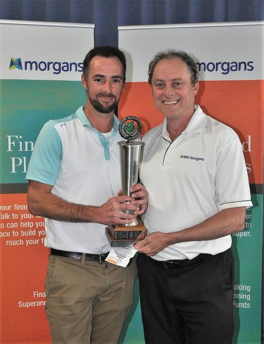 Tura Open winner Michael Coulter accepts the trophy from Morgans Finance sponsor Greg Thompson. 