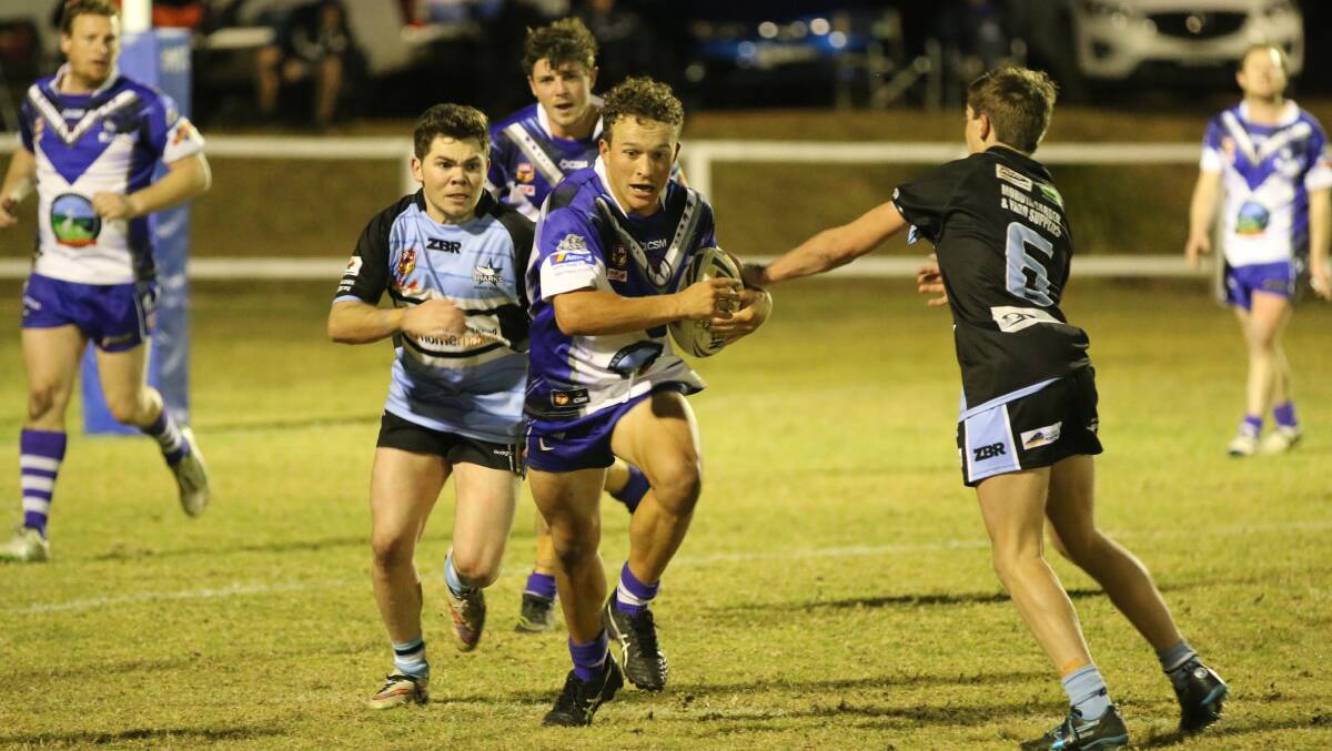 Line-break: Aaron Proctor makes a burst through the Moruya line during a gritty 28-20 win in the reserve grade Saturday night. 