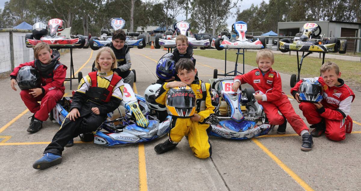 Having a ball: Junior drivers stop for a quick photo before their first official races in the Sapphire Cup on Saturday. Picture: Jacob McMaster