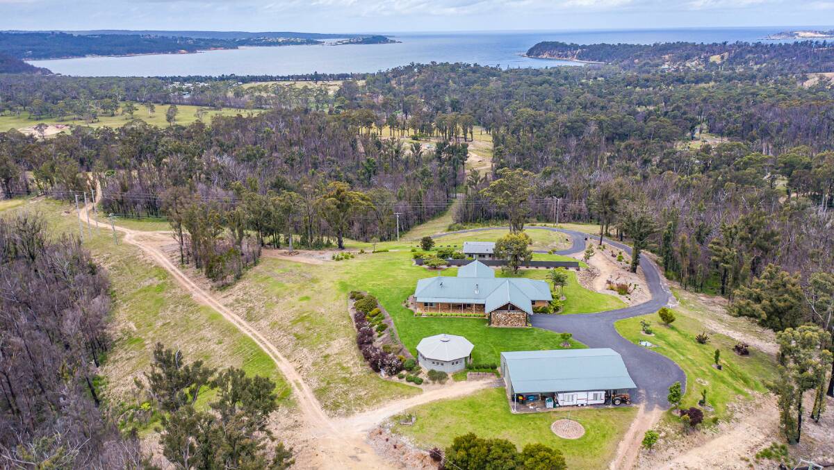 An aerial shot shows the expansive 30 acre property with sweeping views in the distance to Twofold Bay and the Eden township.