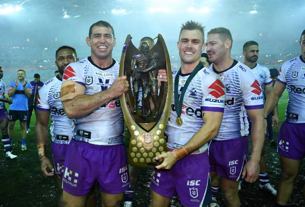 Bega grin: Dale Finucane and Ryan Papenhuyzen hoist the Telstra NRL Premiership after the 2020 grand final with Finucane saying it's a career highlight from his time at the Storm. Picture: Gregg Porteous/ NRL. 