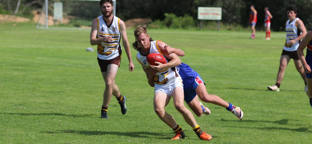 Ladder position: A Panther gets nabbed by his Merimbula opponent during the Lightning Cup with the Pambula club holding good position in all three senior grades. 