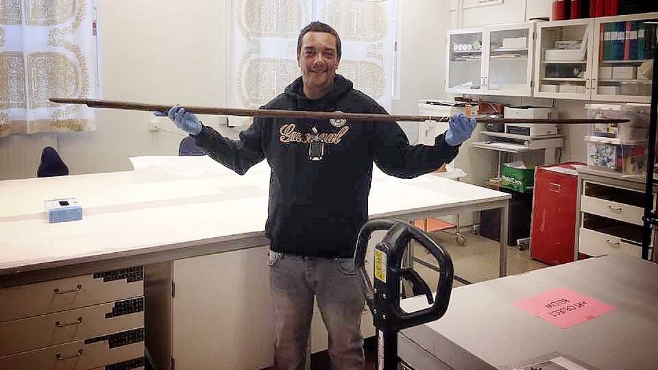 LOBBYING FOR RETURN: Bermagui's Rodney 'Murrum' Kelly holds a Gweagal spear inside a storage room at the Swedish Ethnographic Museum in Stockholm. Picture: Supplied