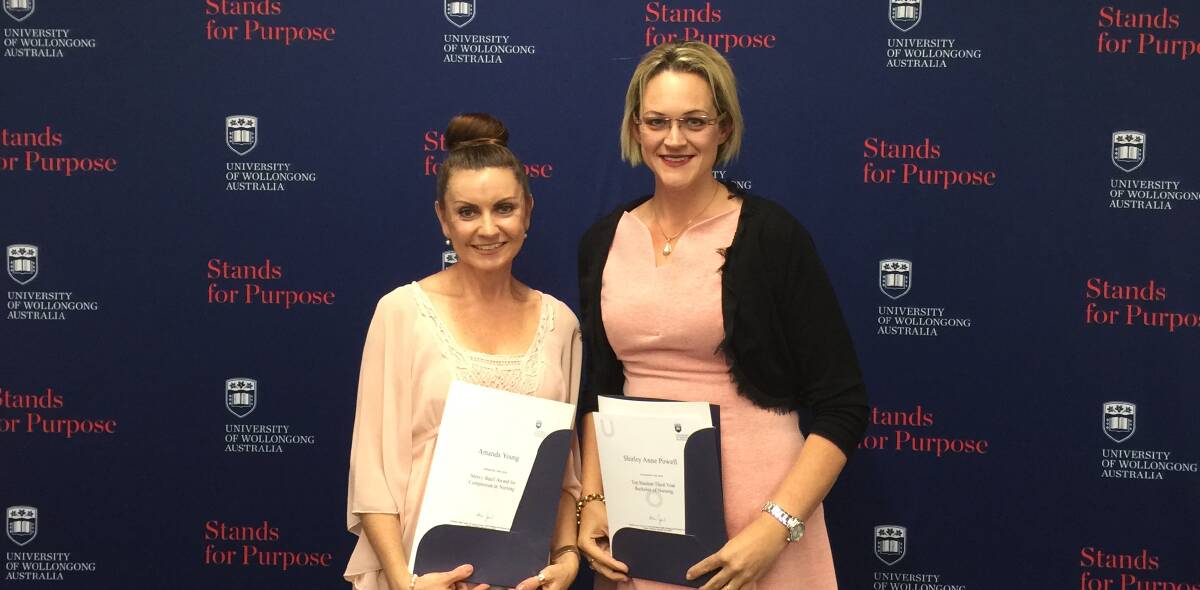 Amanda Young (left) received the 2017 Merci Baafi award for compassion in Nursing with Shirleyanne Powell (right) who achieved the overall highest academic results of all 330 UOW Bachelor of Nursing graduates of 2016.