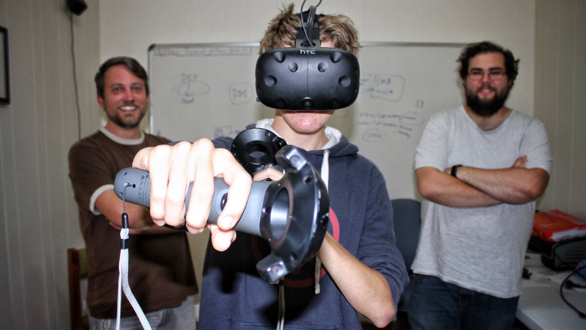 INDEPENDENT: Sixteen-year-old Jade Short wearing some virtual reality gear ahead of this week's Game Central Station workshop with Be Game's Isaac Lynnah and Chris Bateman. Picture: Alasdair McDonald
