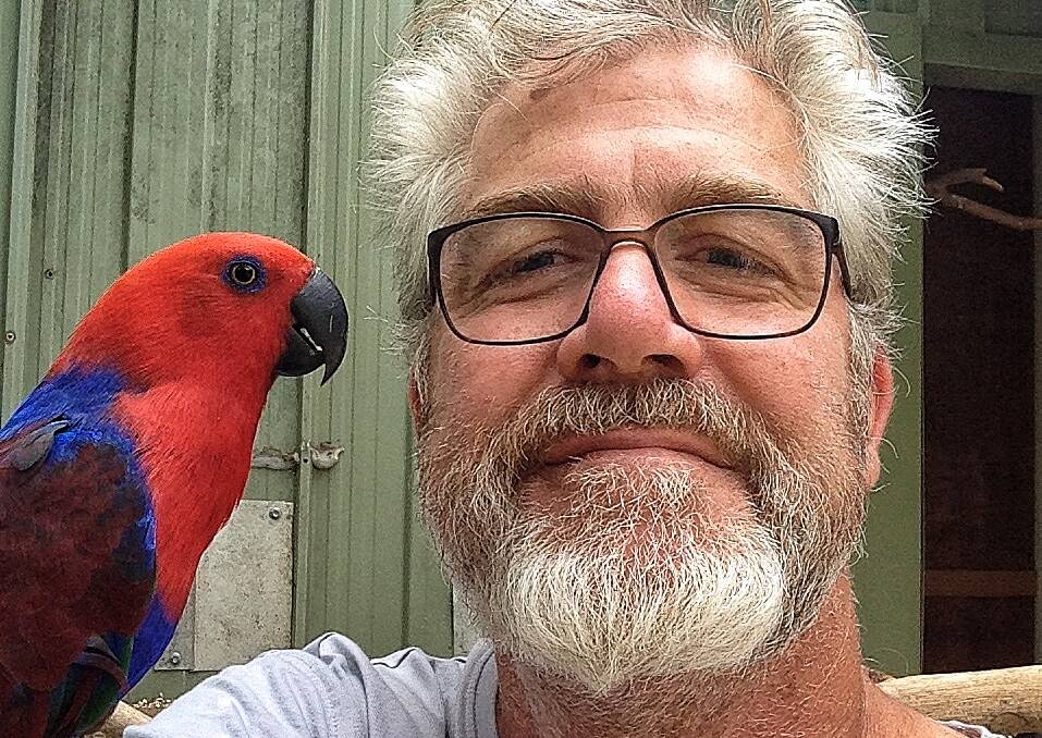 CONCERNED: Former reptile keeper and pet lover Brendan Ryan with his Papua New Guinean eclectus parrot named Little Blue. Photo: Supplied
