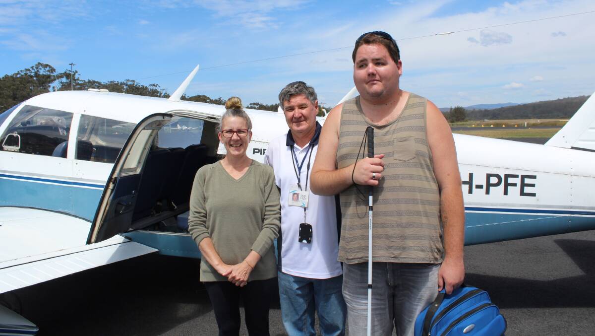 PENULTIMATE TRIP: Zac Cheney (right) boarding an Angle Flight service at Merimbula Airport with his mother, Carole, and pilot Garry Mostyn.