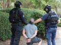 NSW police make an arrest as part of a 12-month investigation into organised crime. Picture NSW police