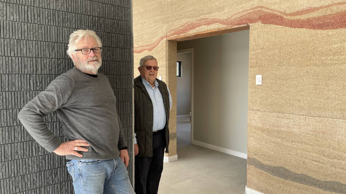 Architect Alan Smith and owner Barry Lambert inside one of the houses built from hempcrete. Picture by Julia Driscoll