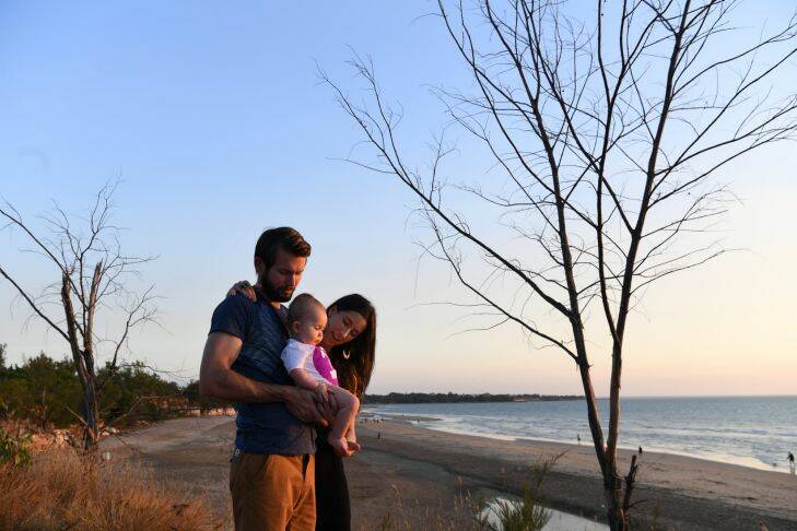 Bethan McElwee and her husband Johnny McElwee with their daughter Aviana McElwee on her first birthday. the Family enjoy a picnic at sunset at Cassuarina Beach, Darwin, NT. Aviana has Spinal Muscular Atrophy (SMA) Type 1 which has a life expectancy of 1 to 2 years.  7th July 2017. Photo: Louise Kennerley SMH story by Kate Aubusson