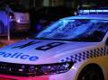 NSW Police are still seeking up to 50 people who allegedly attacked officers outside a church. (Paul Braven/AAP PHOTOS)