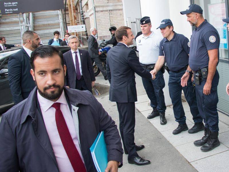Emmanuel Macron's top bodyguard, Alexandre Benalla (L), is being dismissed over a beating.