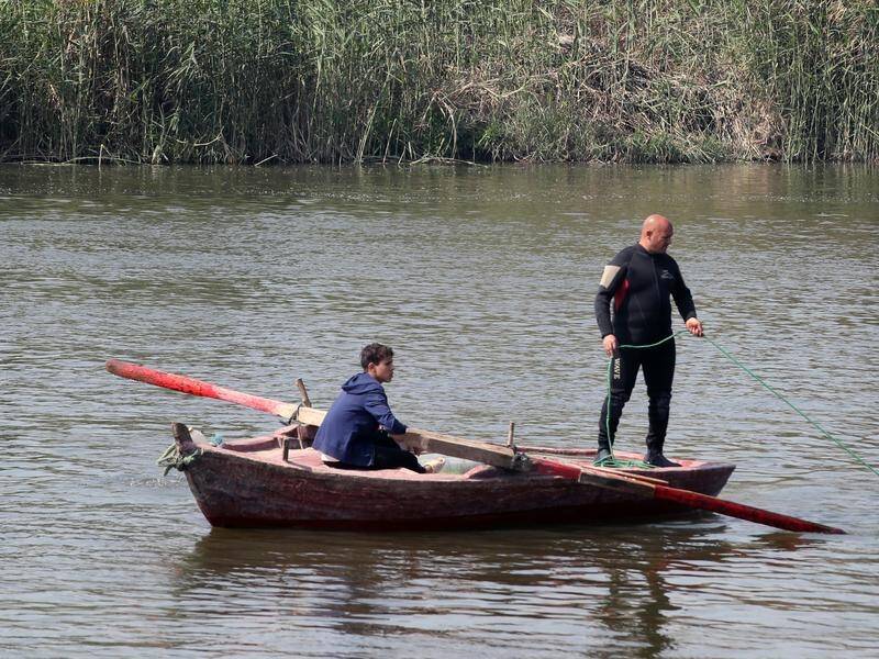 Egyptian officials say it is unclear why a ferry sank on the Nile, leaving at least 10 dead. (EPA PHOTO)