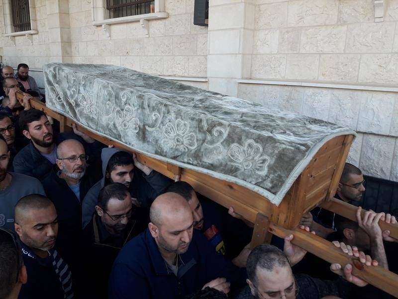 Mourners carry the coffin of Aiia Maarsawe at her funeral in Israel.