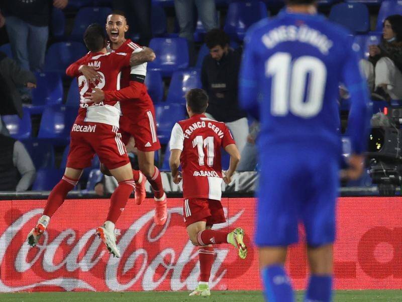 Celta de Vigo celebrate striker Santi Mina's second goal in their La Liga win at Getafe.