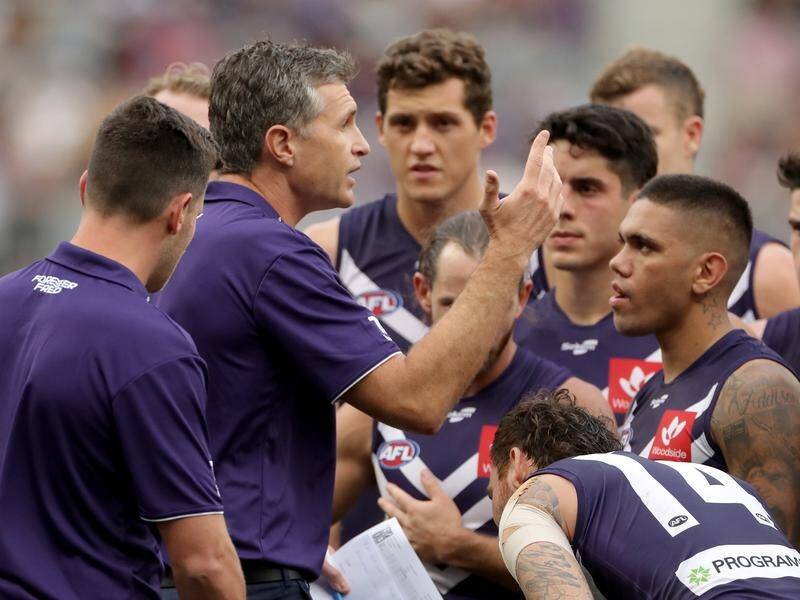 Fremantle coach Justin Longmuir wants the Dockers to adopt a back-to-basics game against Brisbane.